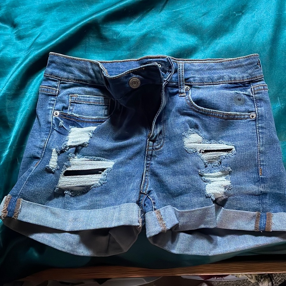 Blue ripped jean shorts